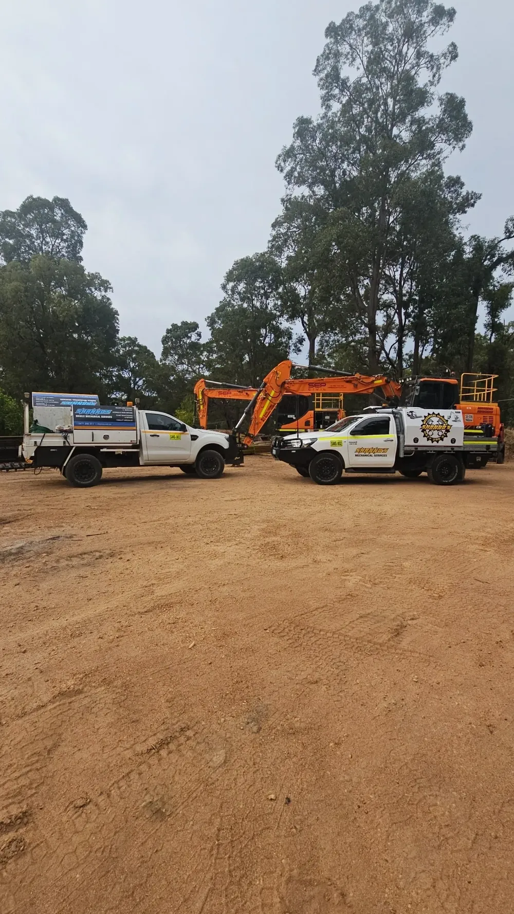 Two Shanno&rsquo;s service utes on site alongside an excavator